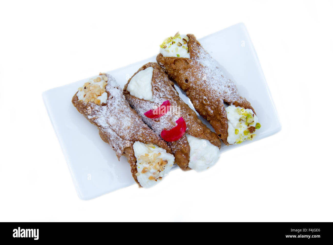 Cannoli with ricotta cheese on a white background seen from above Stock