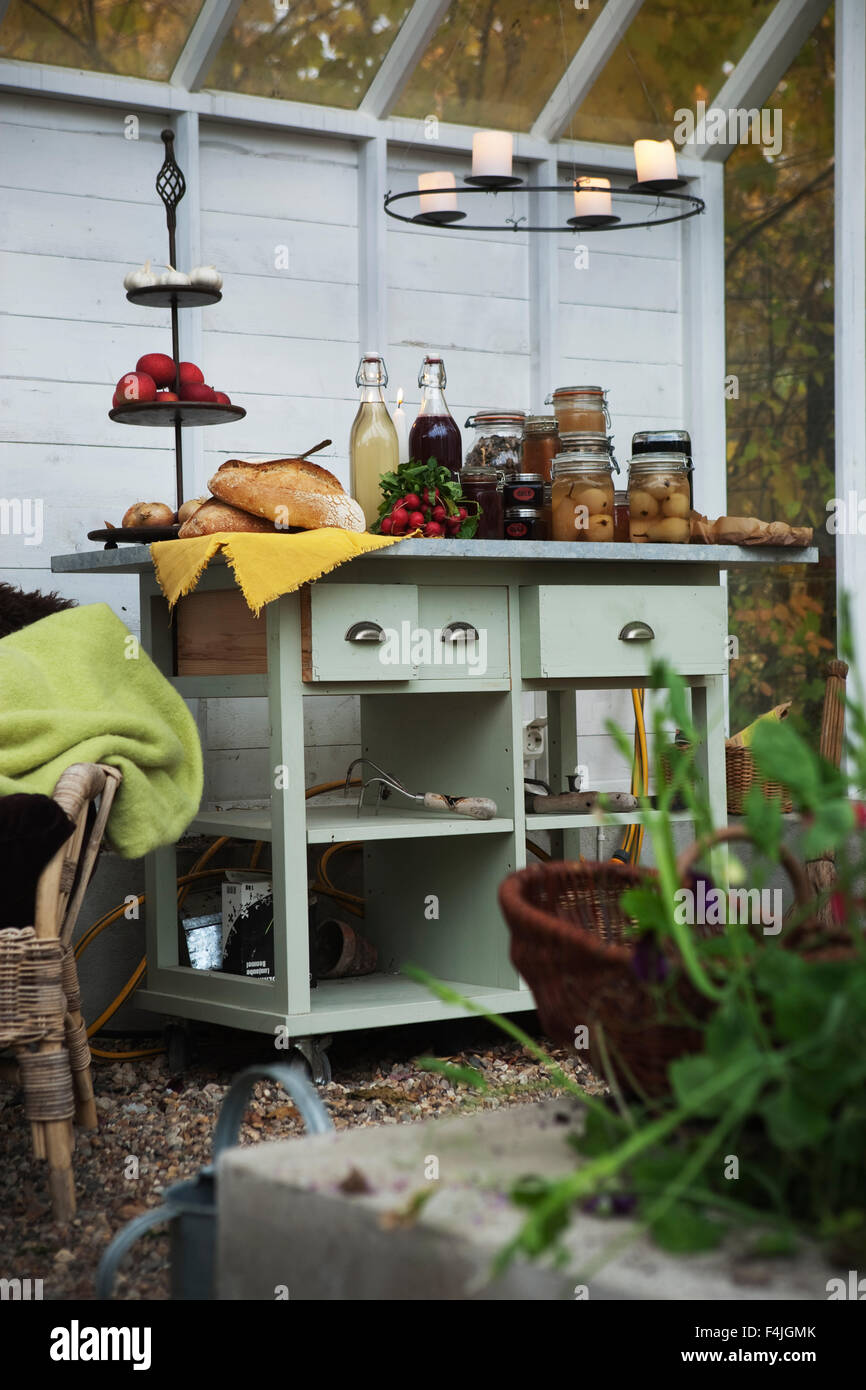 Jars of preserved food on shelf in greenhouse Stock Photo Alamy