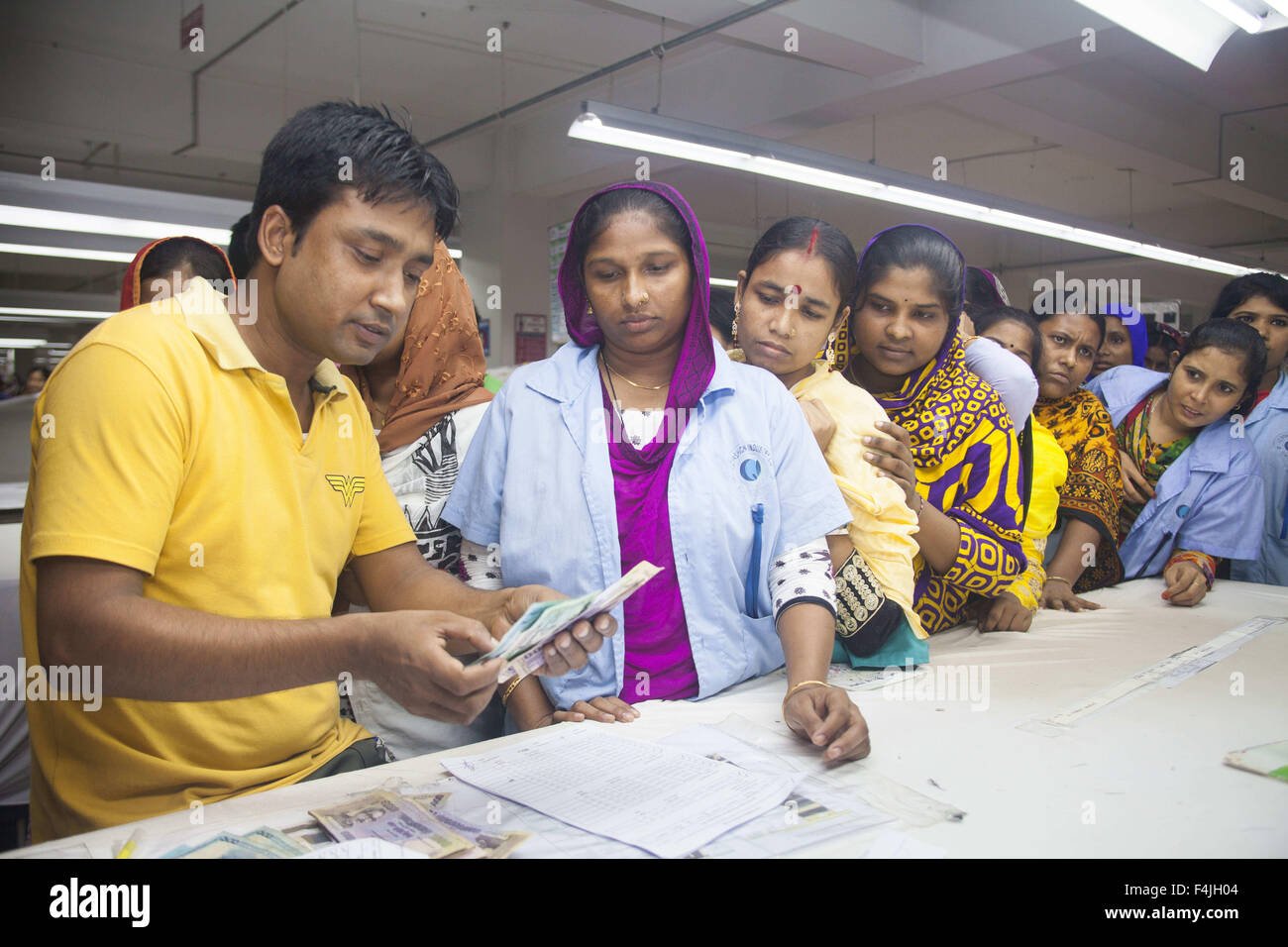 Dhaka, Bangladesh. 23rd Sep, 2015. Bangladeshi garments worker collects