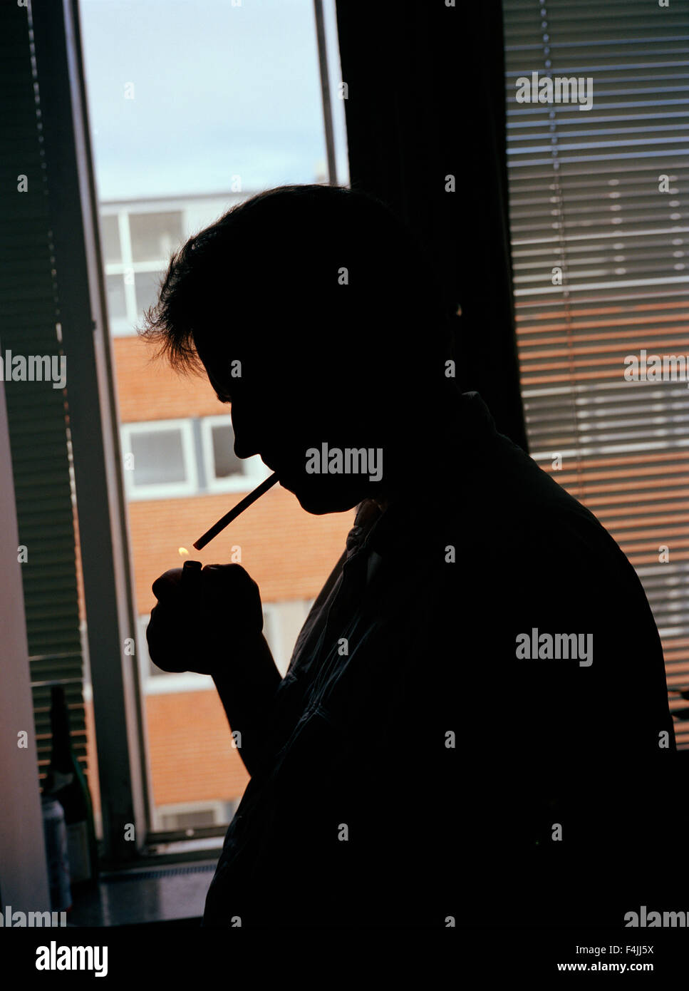 Man lighting cigarette Stock Photo