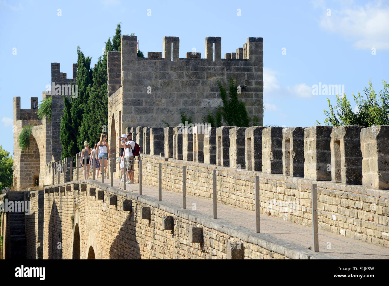 Tourists on the battlements of the ancient city wall, Alcudia Old Town, Balearic Islands, Majorca, Mallorca, Spain Stock Photo
