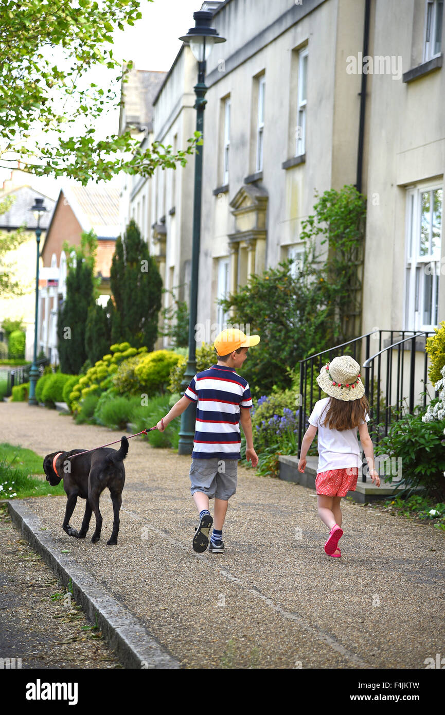 Children walking a dog, Britain, UK Stock Photo Alamy