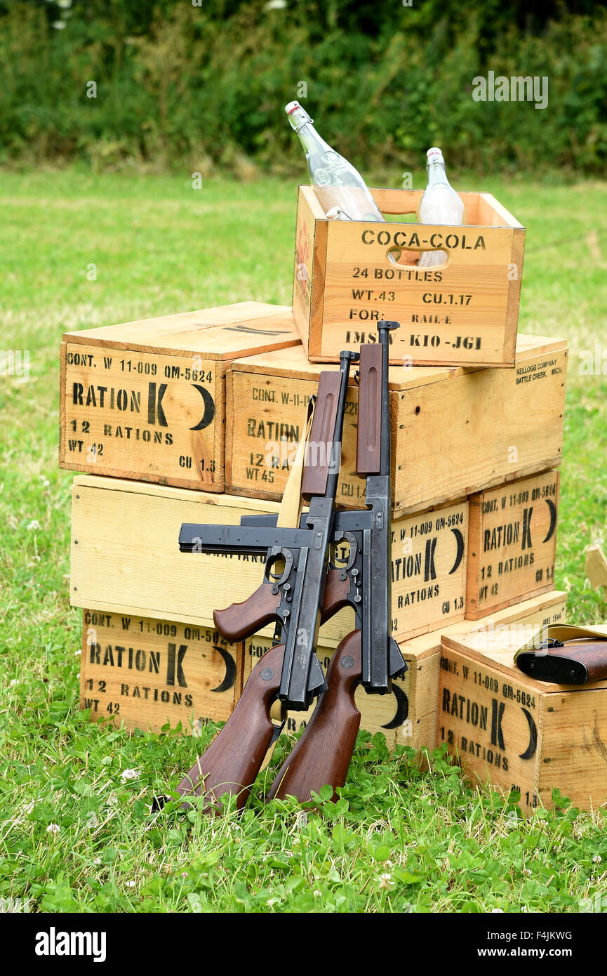 Thompson submachine guns M1A1 leaning against ration boxes, World War 2 equipment Stock Photo