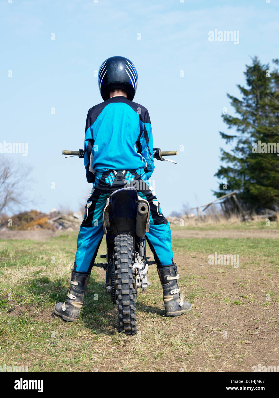 Sweden, Scania, Simrishamn, teenage boy (14-15) on motorbike Stock Photo