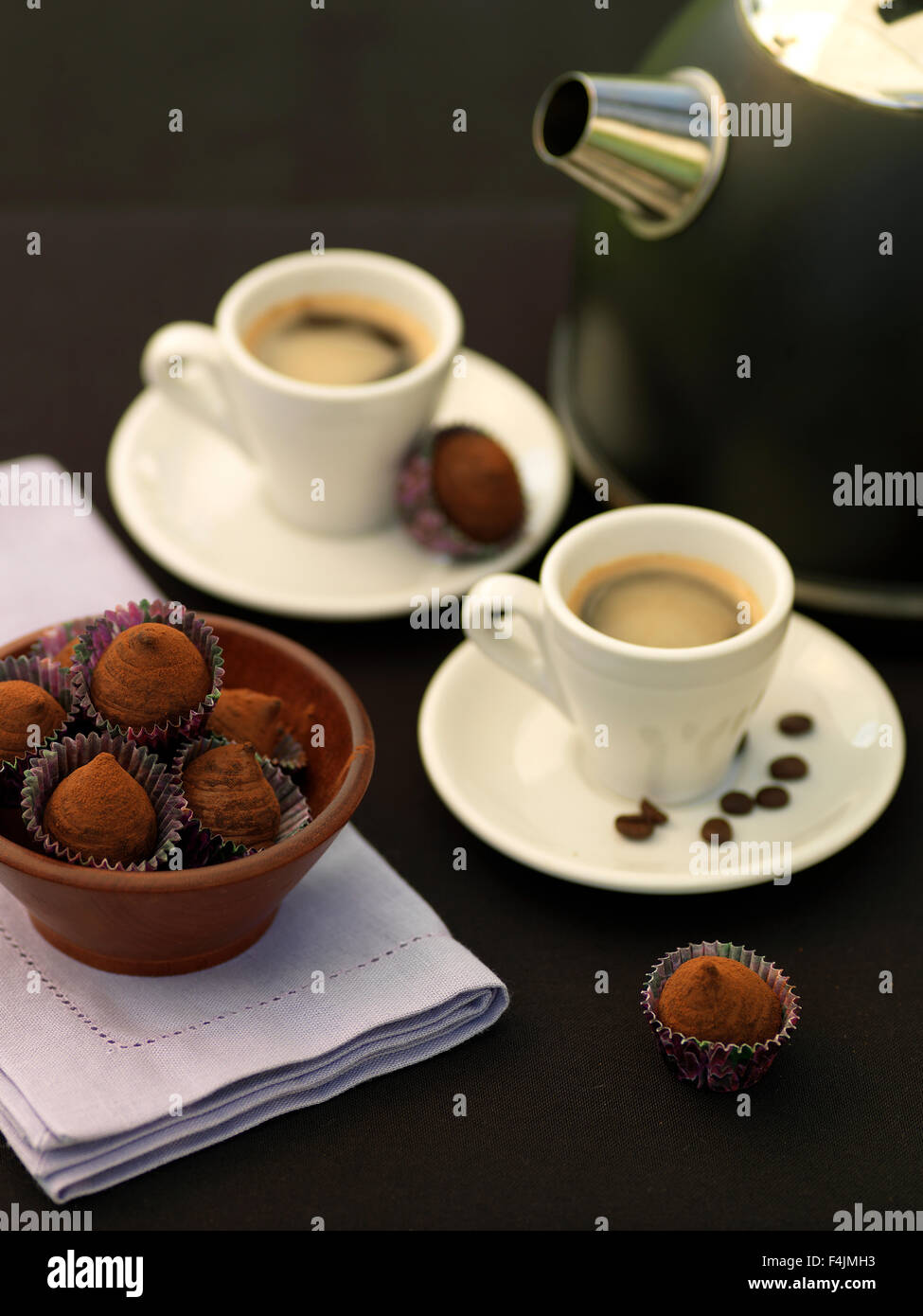 Sweden, Stockholm, Bromma, two espresso coffees with chocolate truffles Stock Photo