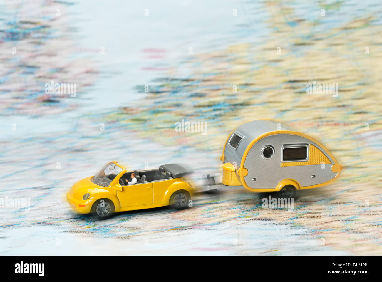 Car with caravan moves on Map of Europe. Stock Photo