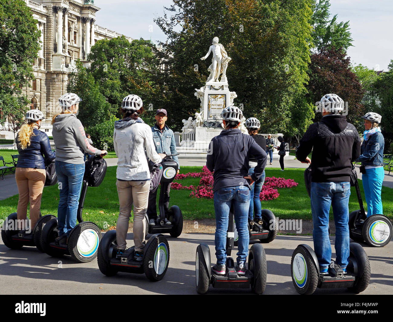 Segway tour at the monument of Mozart in the Burggarten or Imperial Palace Gardens in central Vienna, Austria. Stock Photo