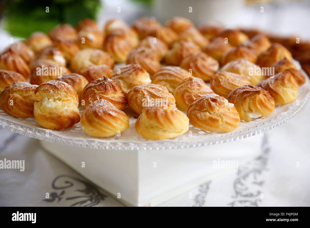 Cream Puffs (Eclairs) on a buffet table Stock Photo
