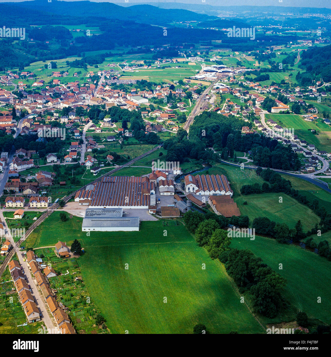 Aerial view of spinning mills and town, Aumontzey, Vosges, Lorraine, France Stock Photo