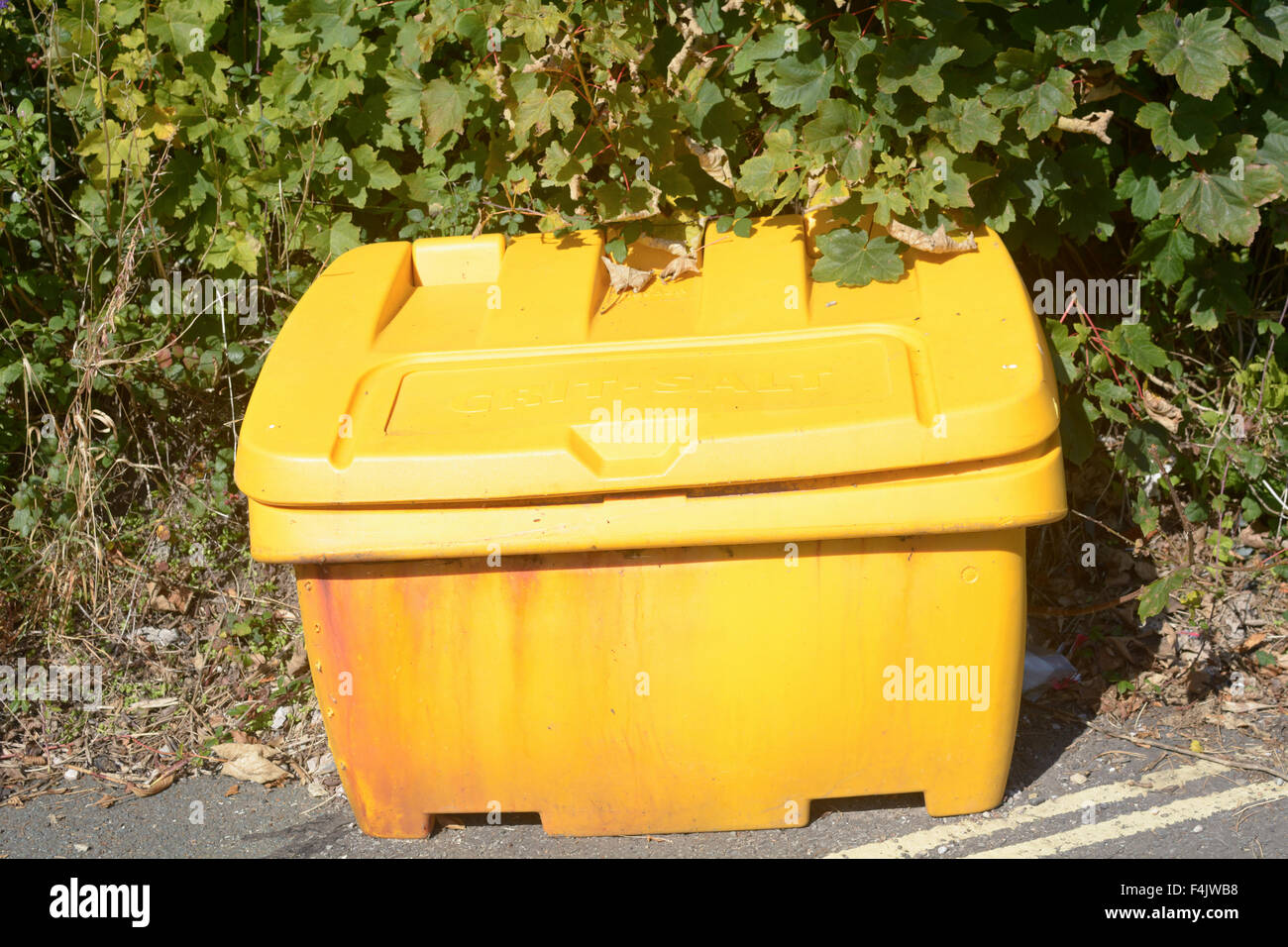 Yellow grit box besides road on steep hill Stock Photo Alamy