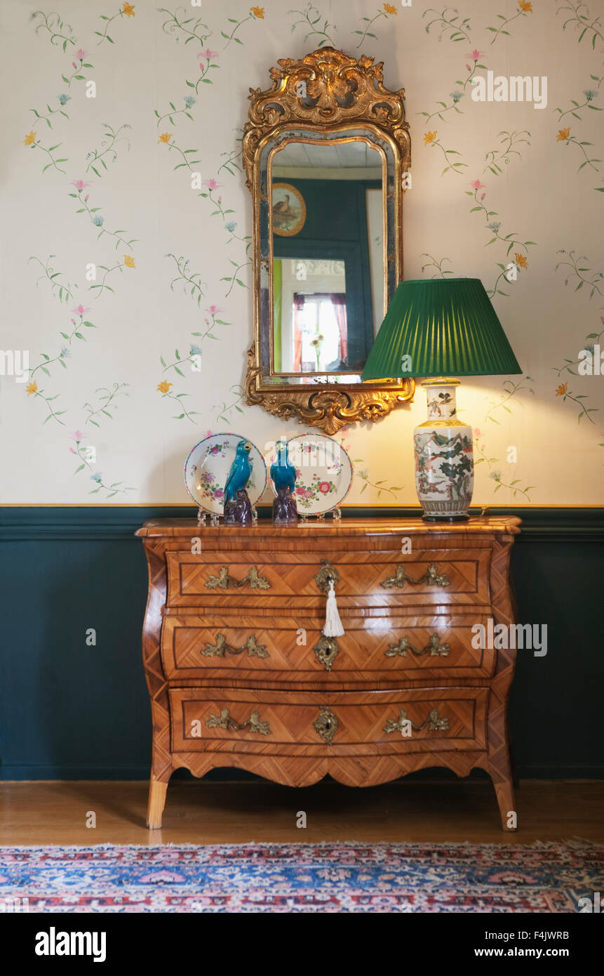 Lamp shade on chest of drawers Stock Photo Alamy