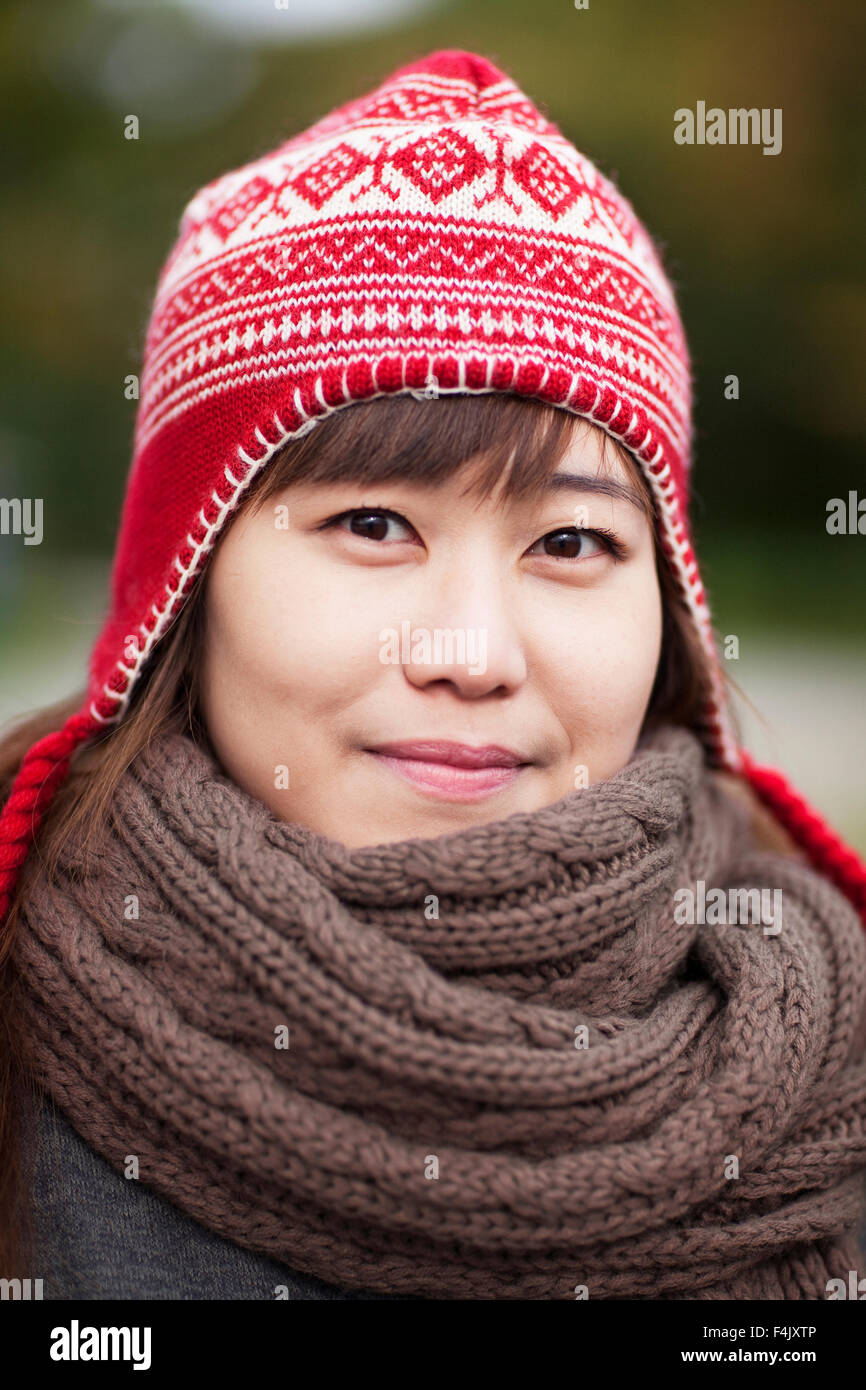 Portrait of happy young woman wearing wooly hat Stock Photo