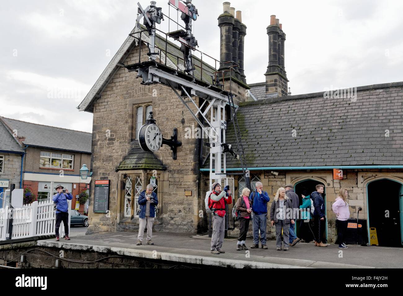 Steam train enthusiasts on Grosmont station North Yorkshire UK Stock Photo