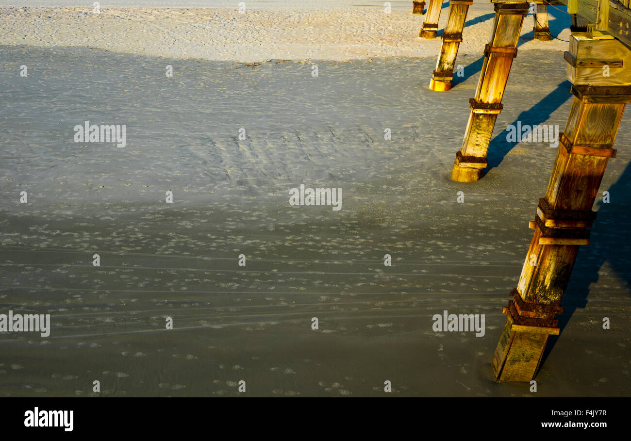 Legs off old wooden pier in usa Stock Photo