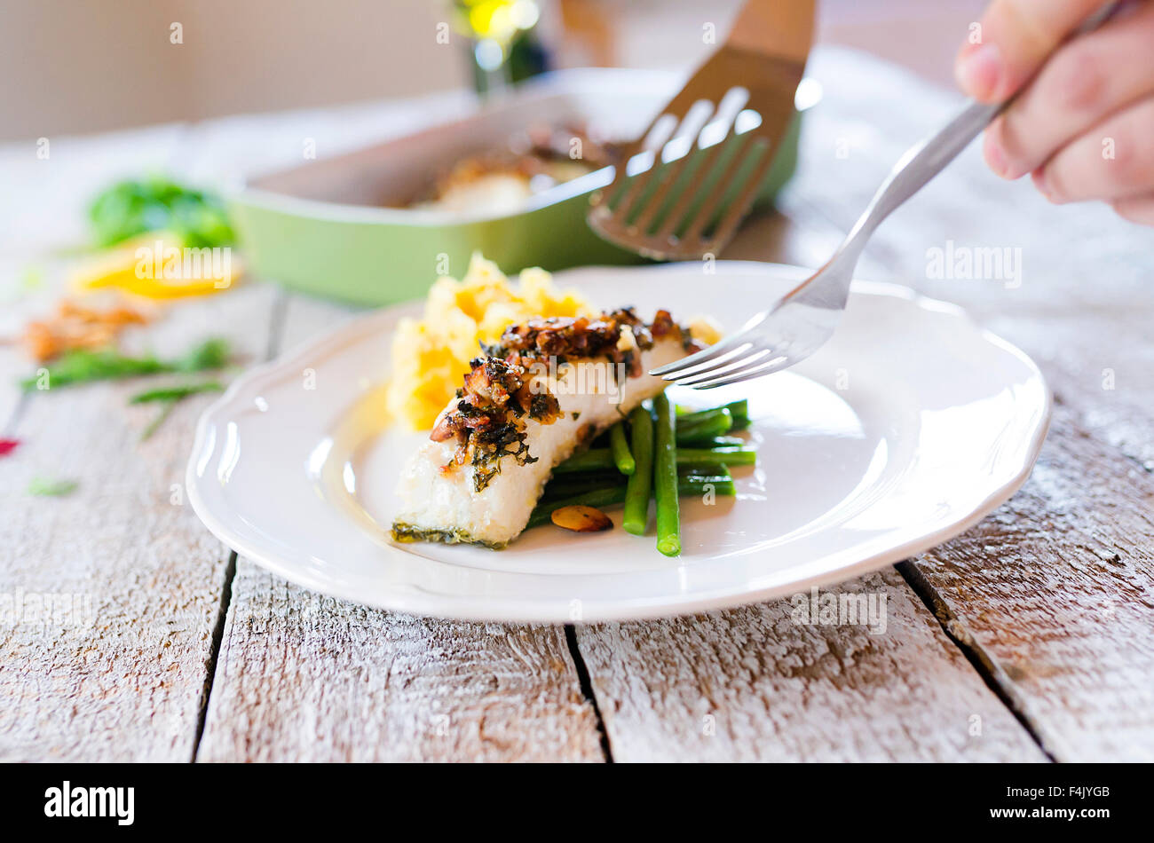 Man serving fish Stock Photo Alamy