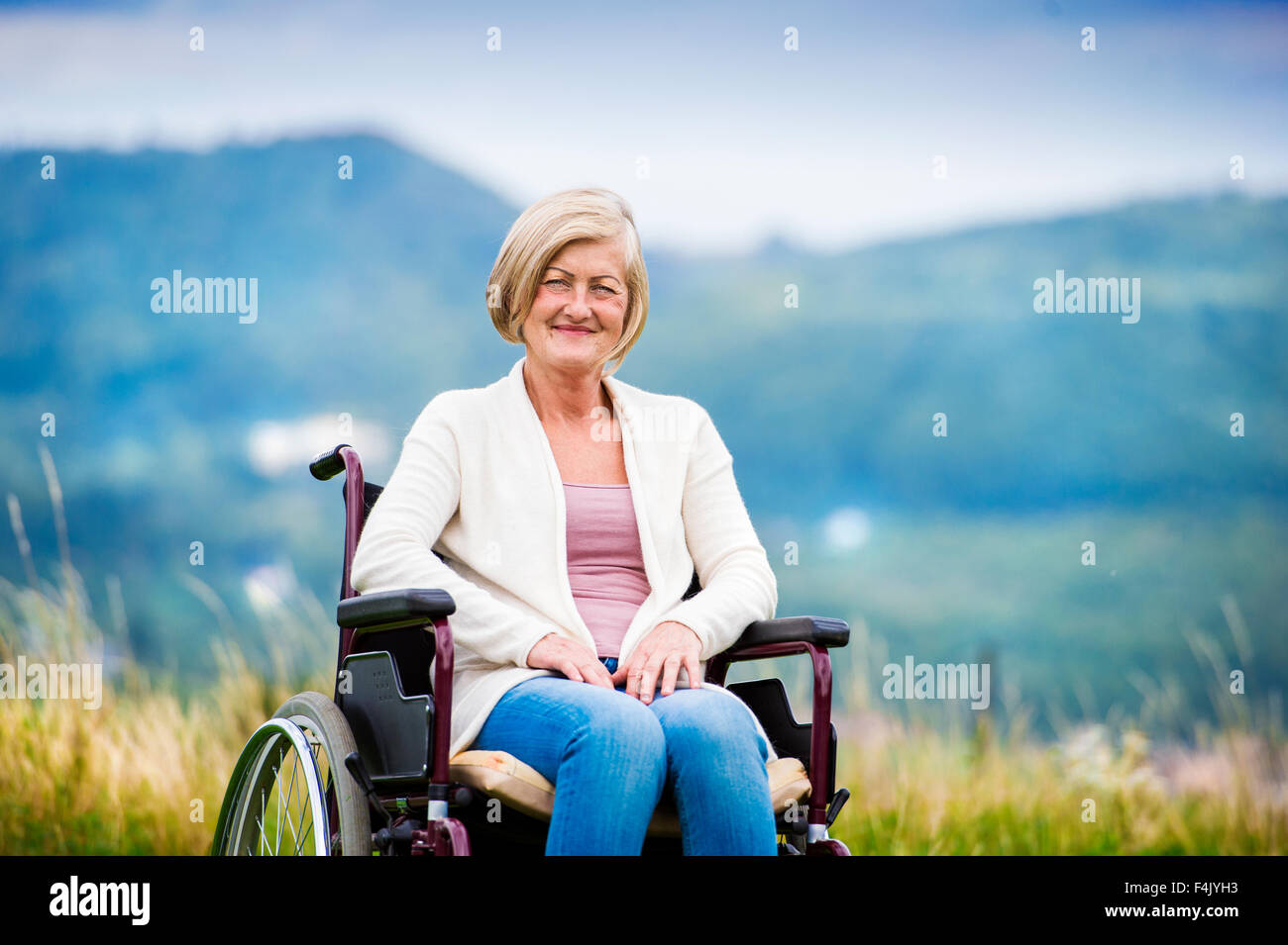 Woman in wheelchair hi-res stock photography and images - Alamy