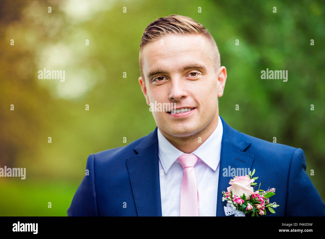 Handsome young groom Stock Photo - Alamy