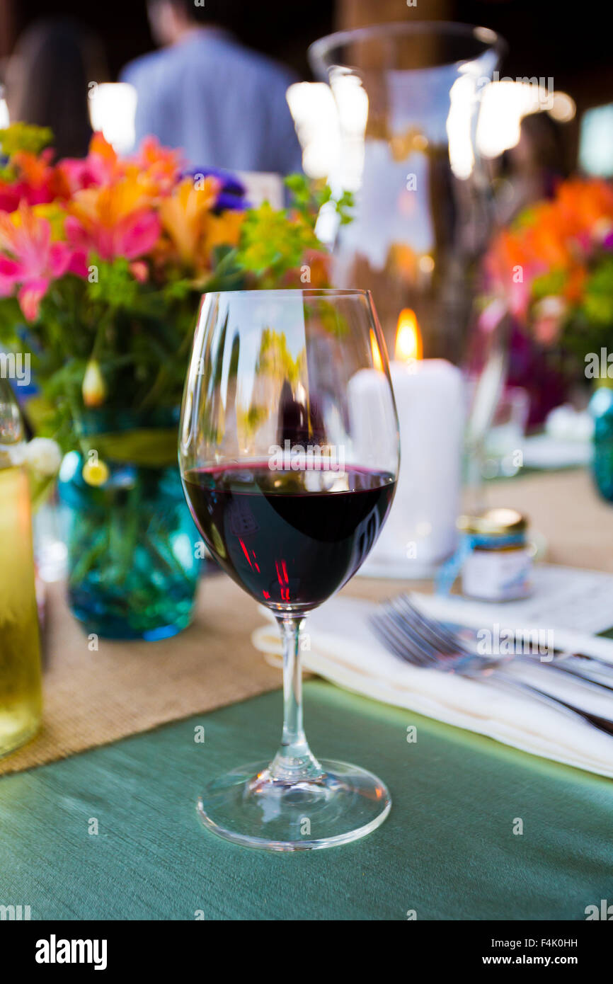 Red wine in a fine glass at a wedding reception in Southern Oregon at a winery vineyard. Stock Photo