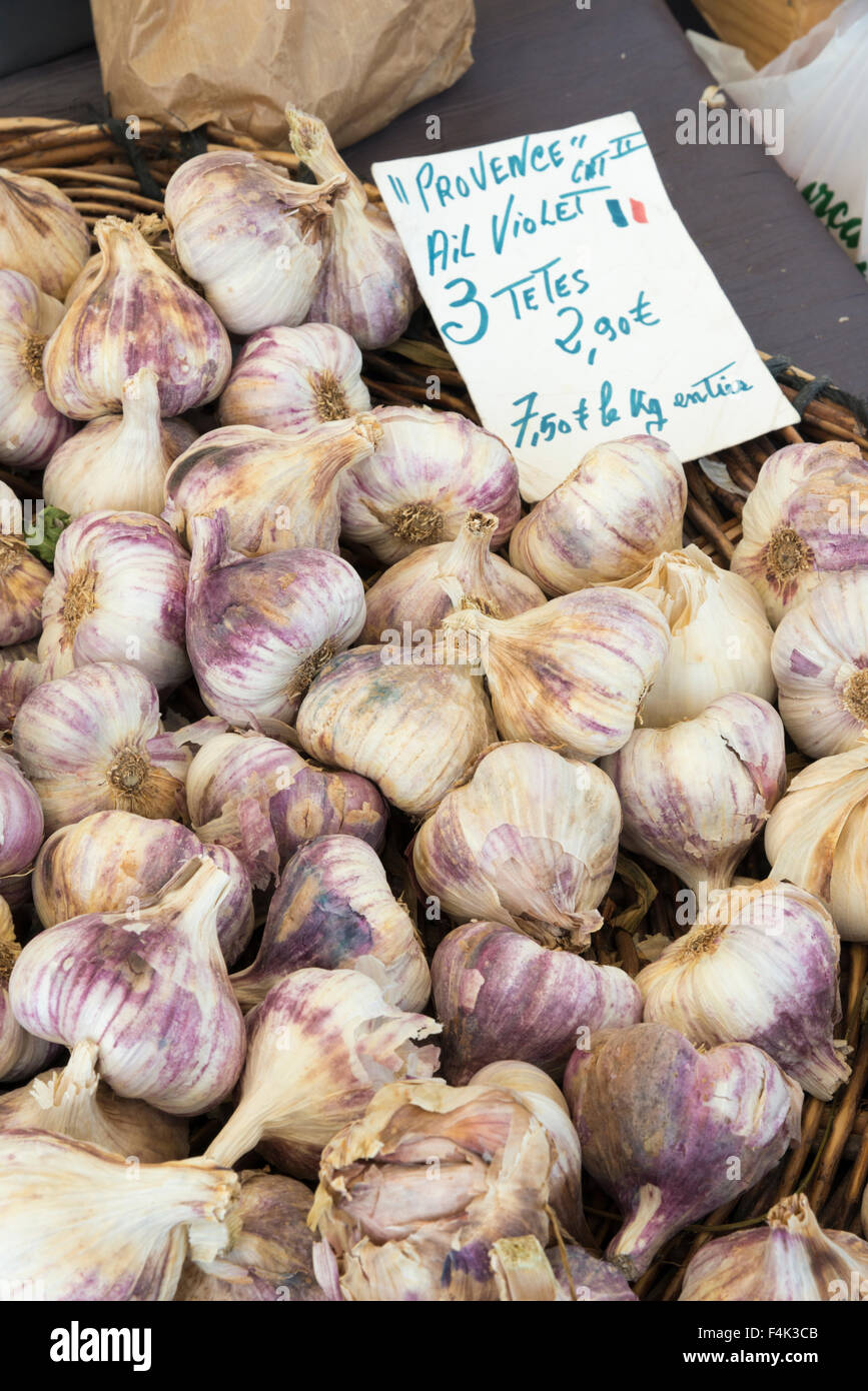 Garlic for sale in a market in Provence France with a price label and sign Stock Photo