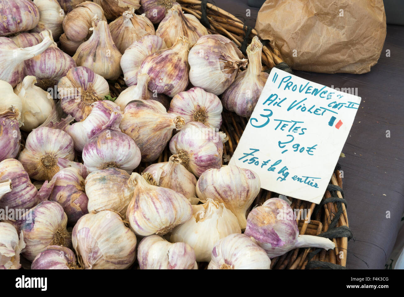 Garlic for sale in a market in Provence France with a price label and sign Stock Photo