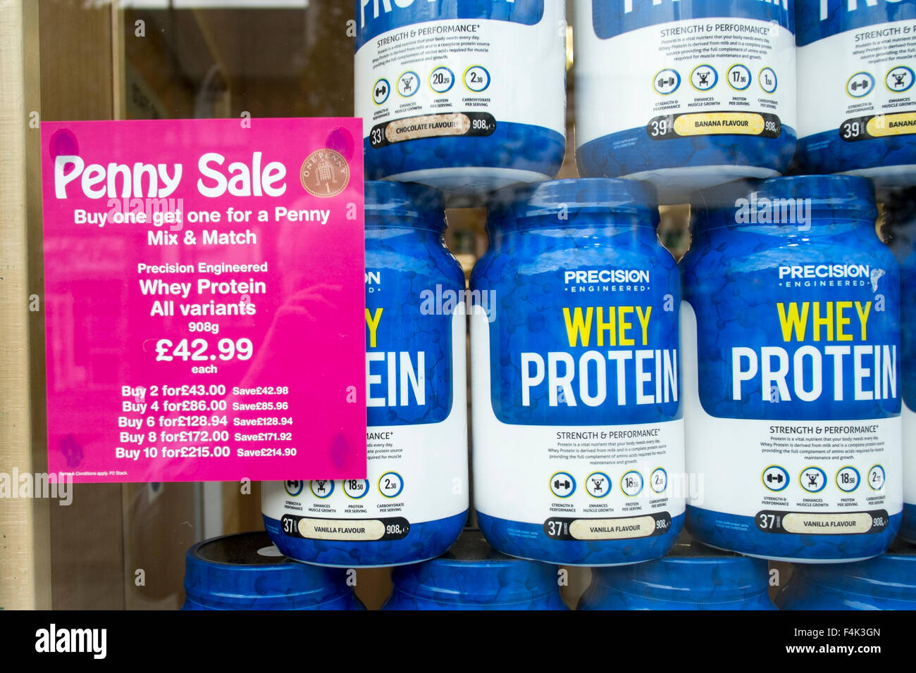 Penny Sale of Jars Precision Whey Protein, at Holland & Barratt, a sales promotion similar to buy one get one Free. BOGOF, Southport, Merseyside, UK Stock Photo