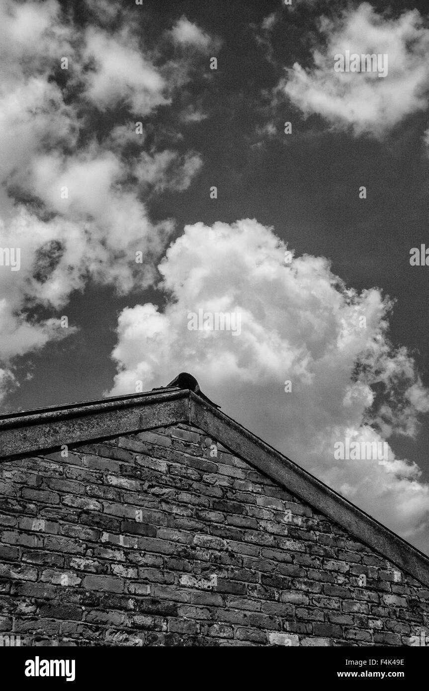 Clouds over gable end Stock Photo - Alamy