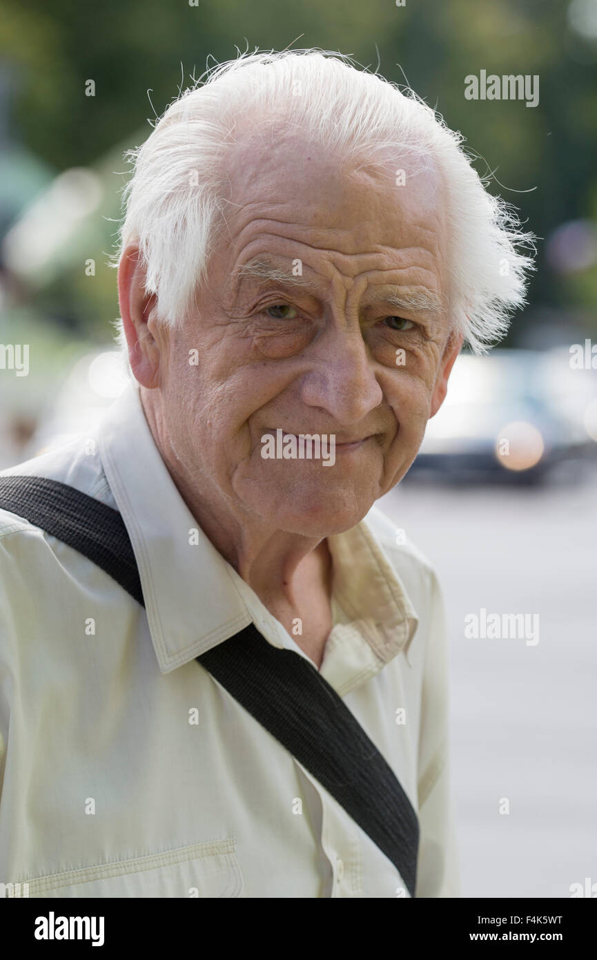 An old man poses for a photograph in Warsaw, Poland Stock Photo