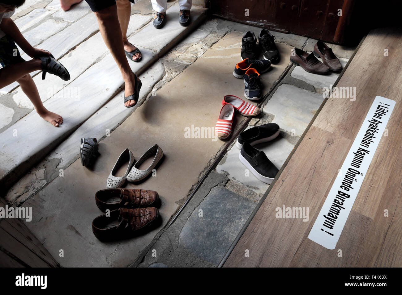 People taking off shoes at the entrance to Muslim Lala Mustafa Pasha Mosque Famagusta in Turkish North Cyprus  KATHY DEWITT Stock Photo