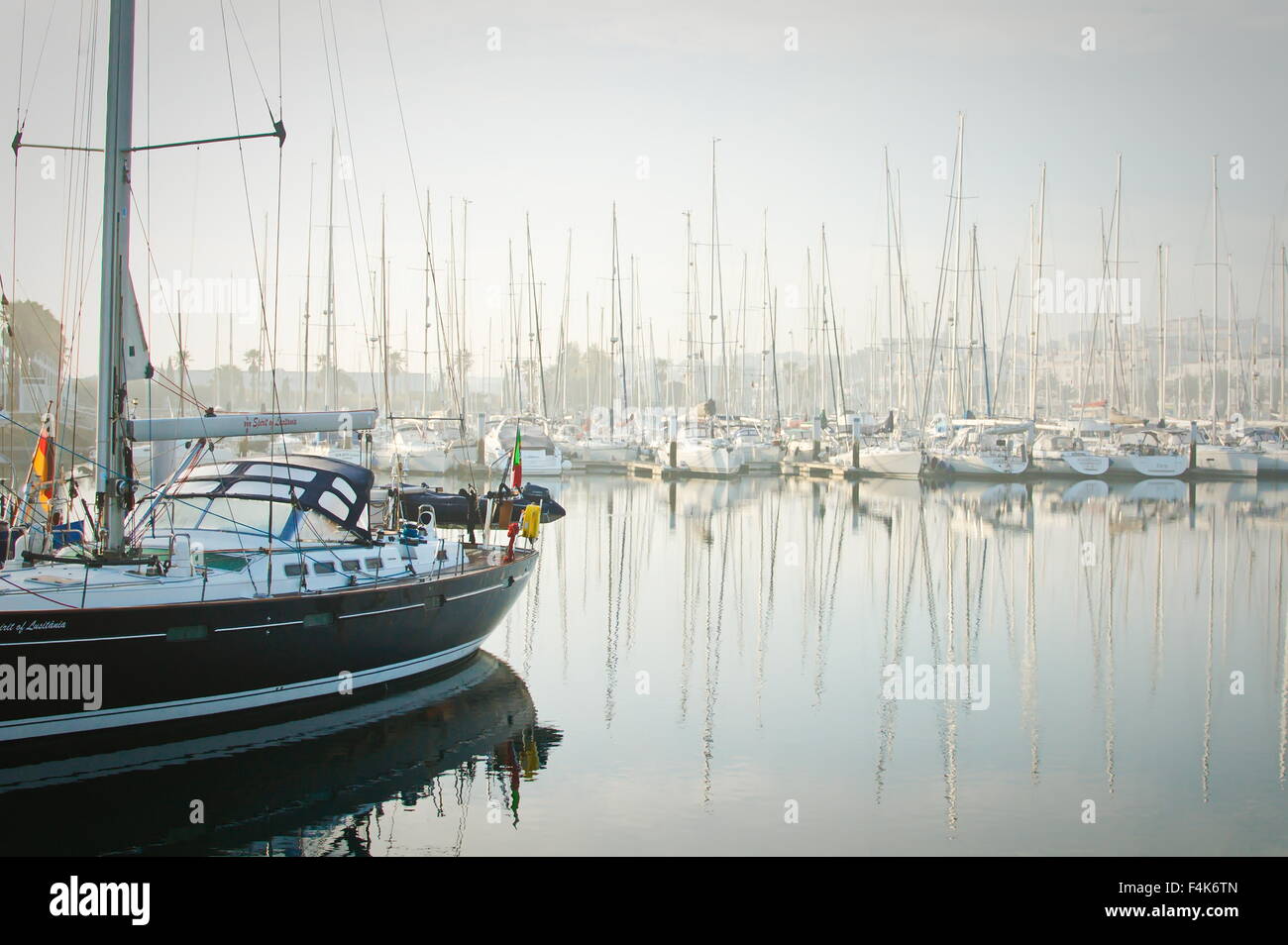 Marina de Lagos, Lagos, Algarve, Portugal, 2015-10-16. Boats moored during a dense fog in the marina. Stock Photo