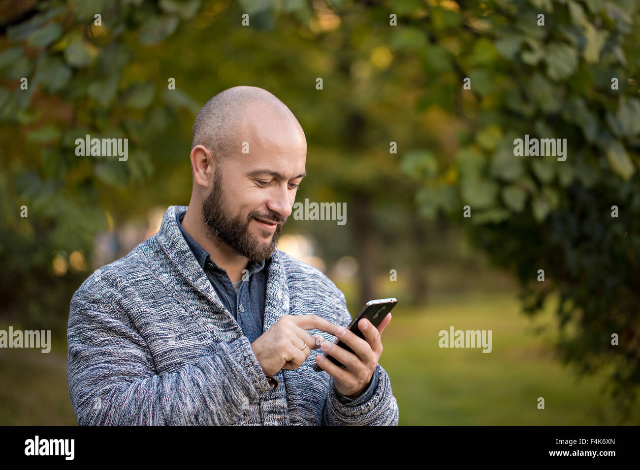 Young man using mobile smart phone Stock Photo - Alamy
