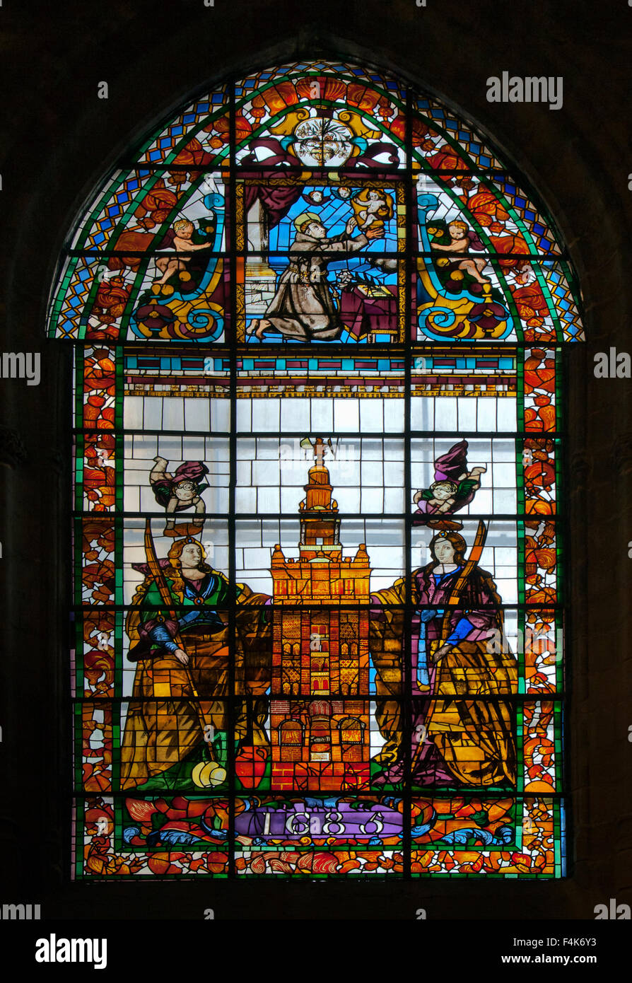 Stained-glass window in Seville cathedral, Spain Stock Photo