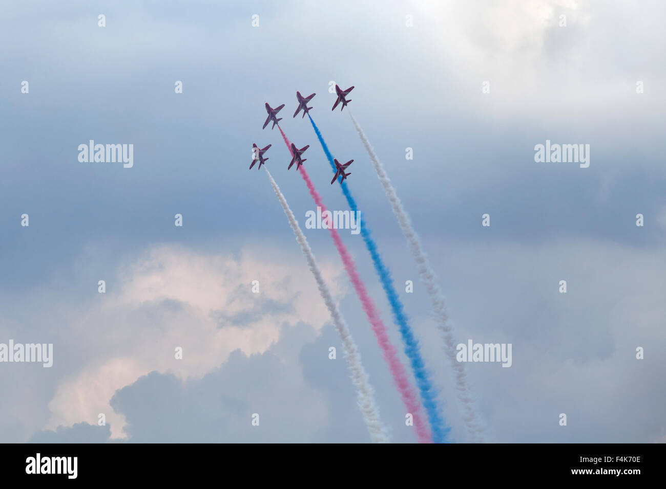 Planes on an air show against cloudy sky Stock Photo - Alamy