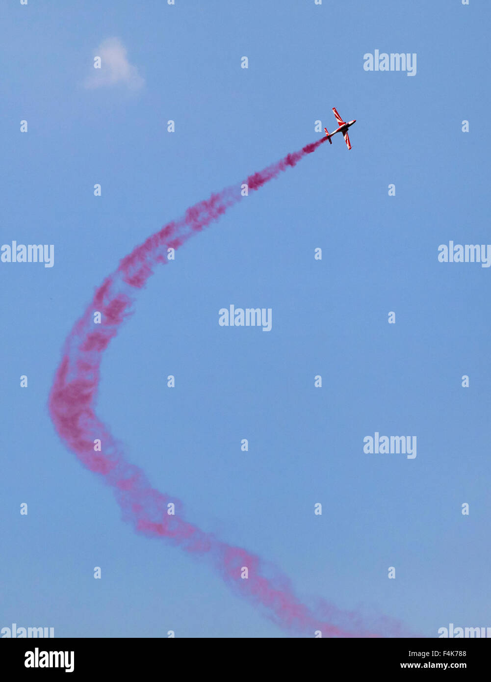 Plane on an air show against blue sky Stock Photo - Alamy