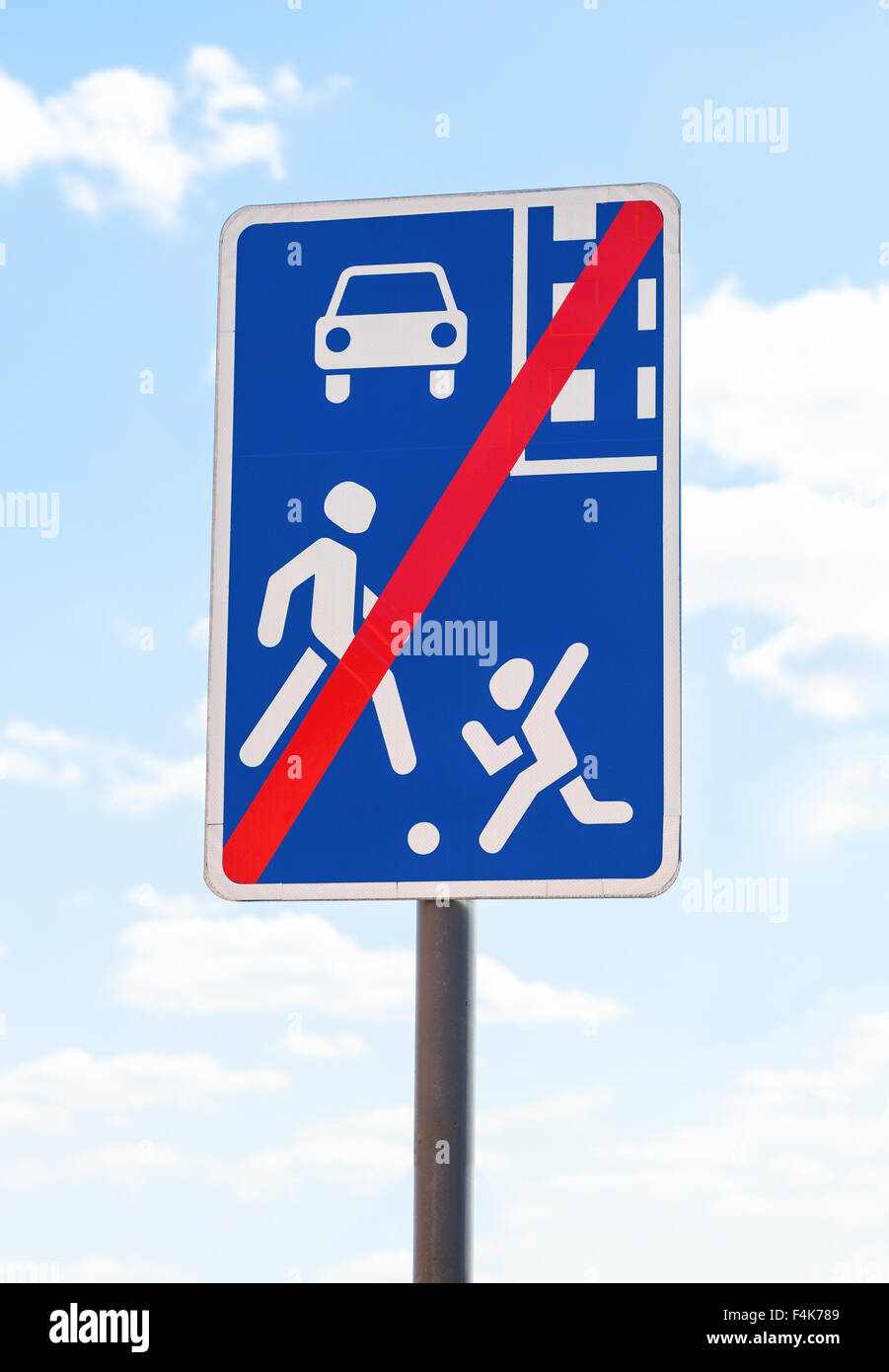Traffic sign End of Residential Zone against the sky Stock Photo