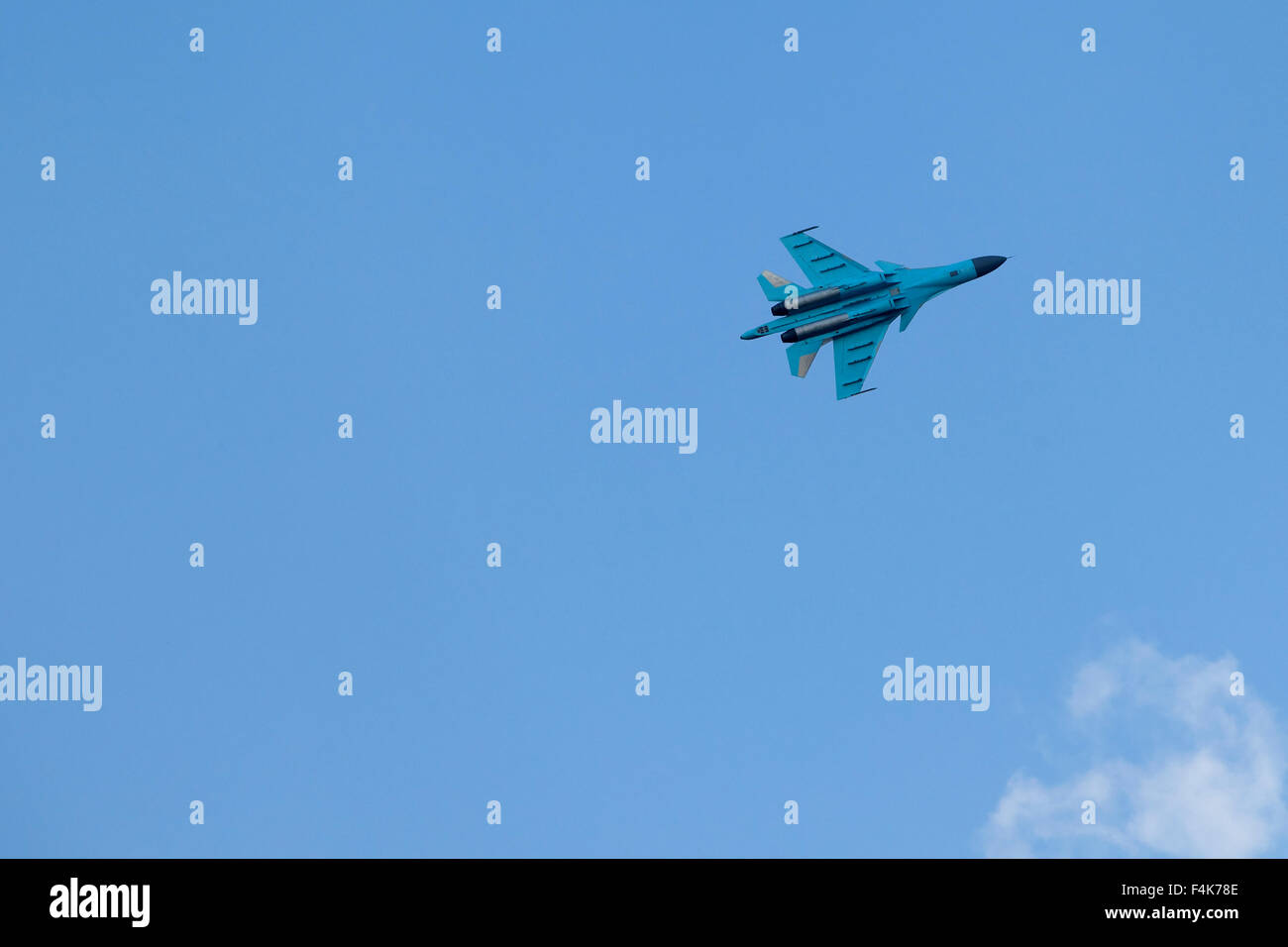 Plane on an air show against blue sky Stock Photo - Alamy
