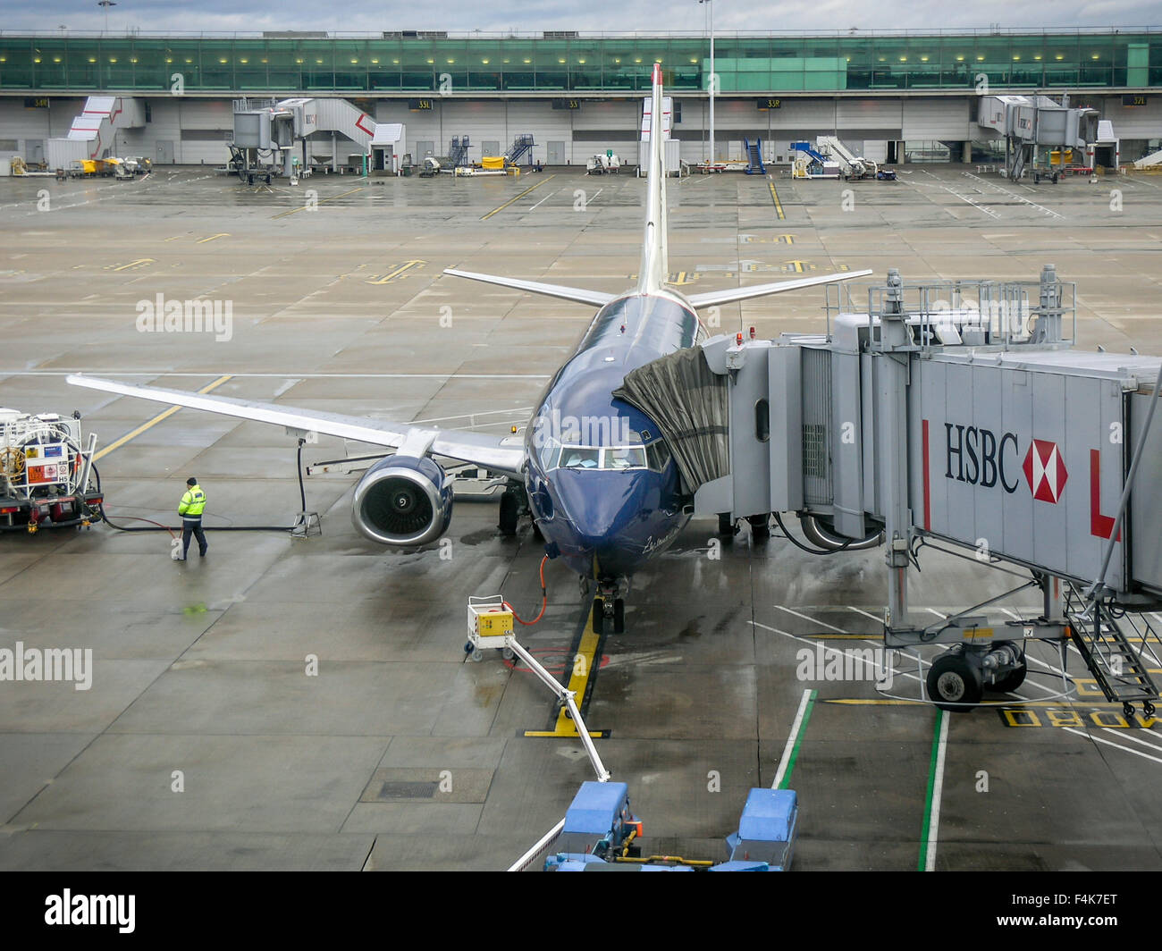 Airplane docking at airport stand, Stansted, United Kingdom Stock Photo