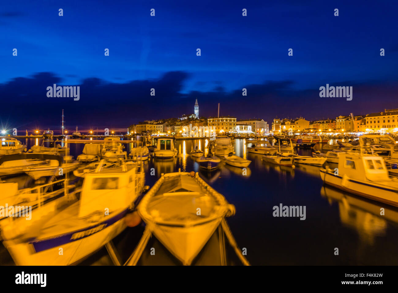 Small boats inside the harbor of an old Venetian town, Rovinj, Croatia Stock Photo