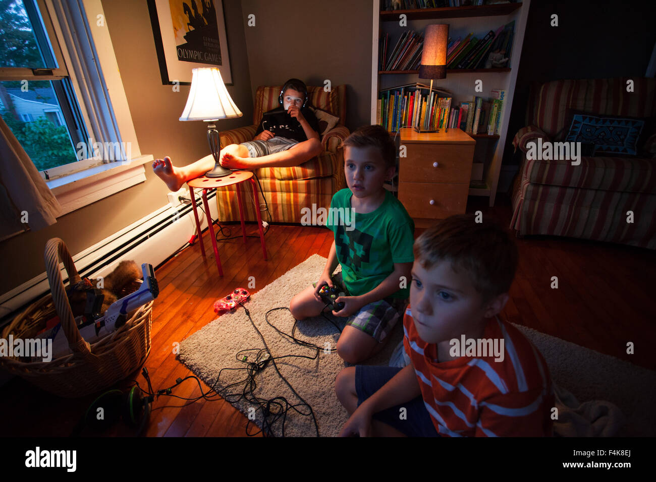 Young girl playing video games on computer after online school and  homework. Gamer using shooting action play for entertainment and fun with  keyboard and monitor. Child enjoying game Stock Photo - Alamy