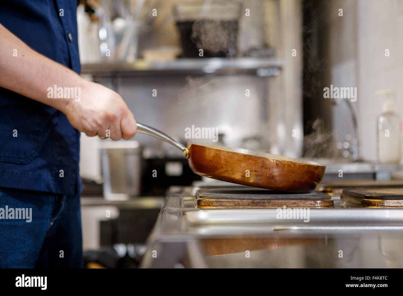 Chef in restaurant kitchen Stock Photo - Alamy