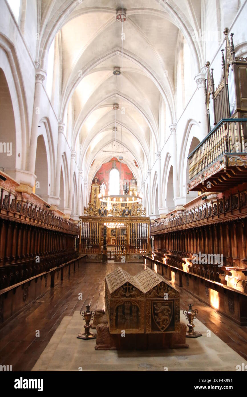 Central nave from Las Huelgas Church, with high medieval arcs, organ, and king's tomb in the center Stock Photo