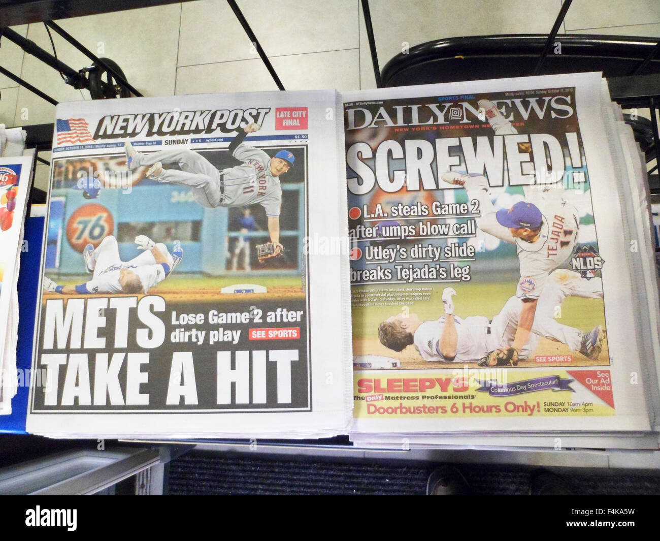 Headlines of New York newspapers are seen on Sunday, October 11, 2015 reporting on the previous days injury to Mets shortstop Ruben Tejada by L.A. Dodgers Chase Utley.  (© Richard B. Levine) Stock Photo