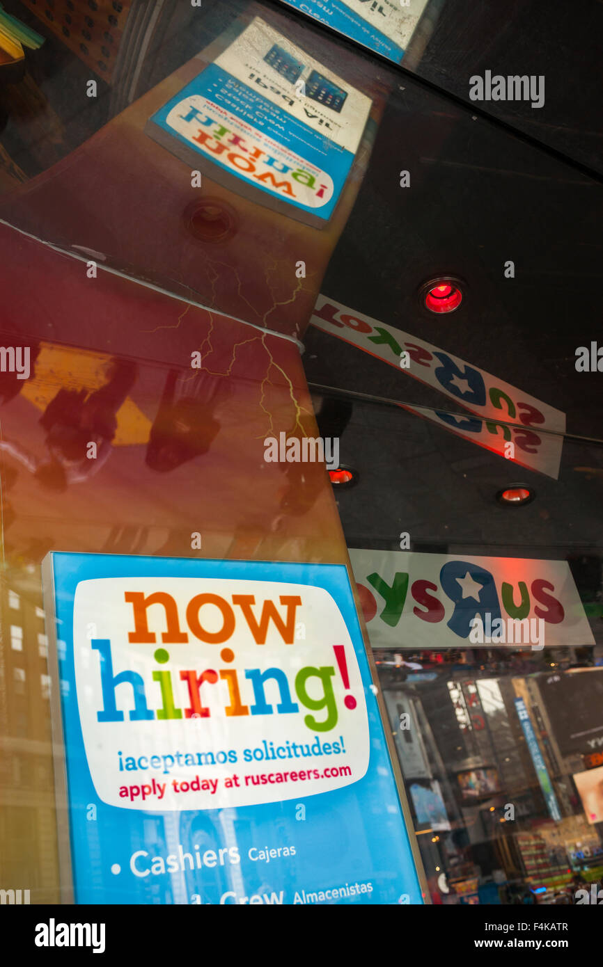 A sign in the window of Toys R Us in Times square in New York advises potential job applicants 