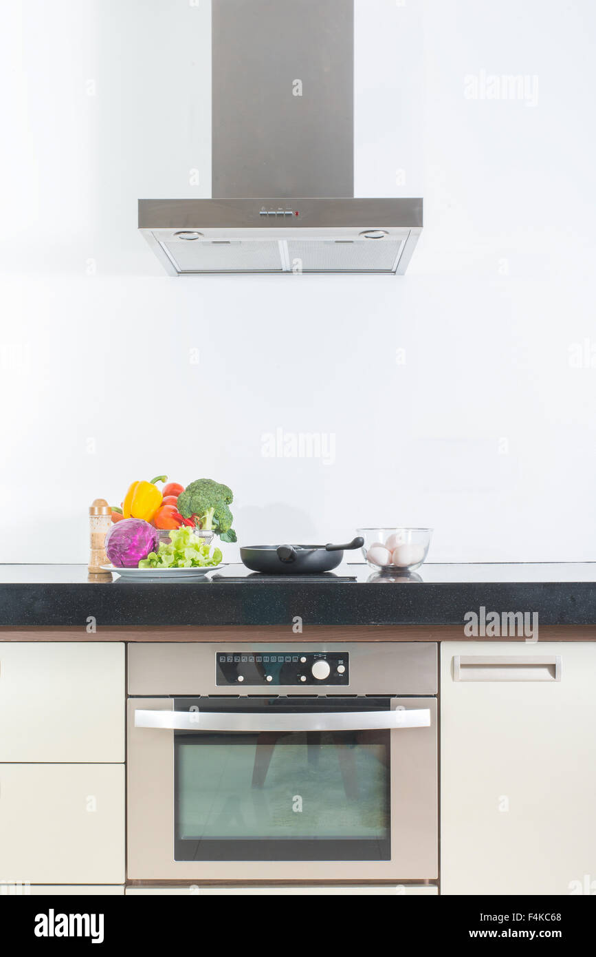 Modern gourmet kitchen interior with vegetable ,egg and pan Stock Photo