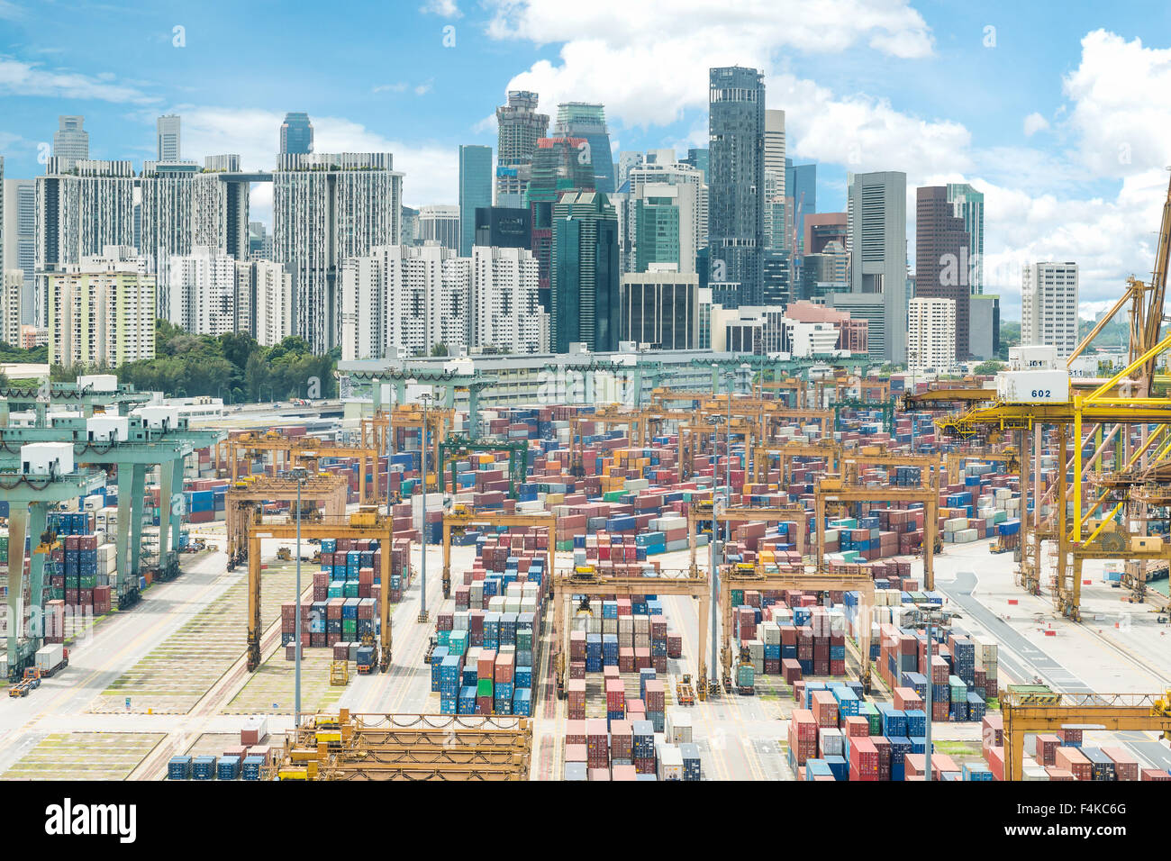 Aerial view of Singapore cargo container port and Singapore city background Stock Photo