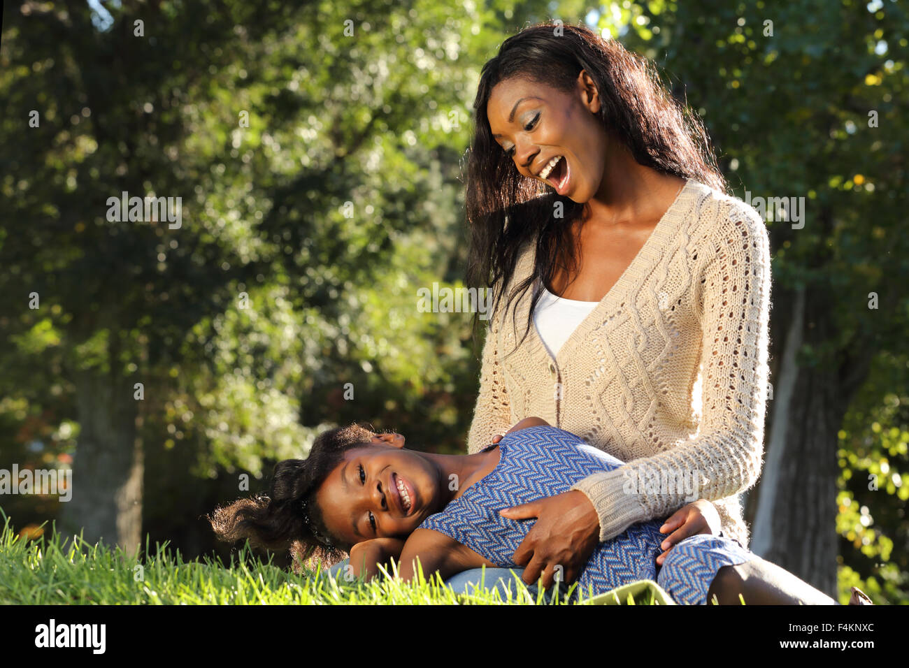 Mother and Child playing in a park Stock Photo