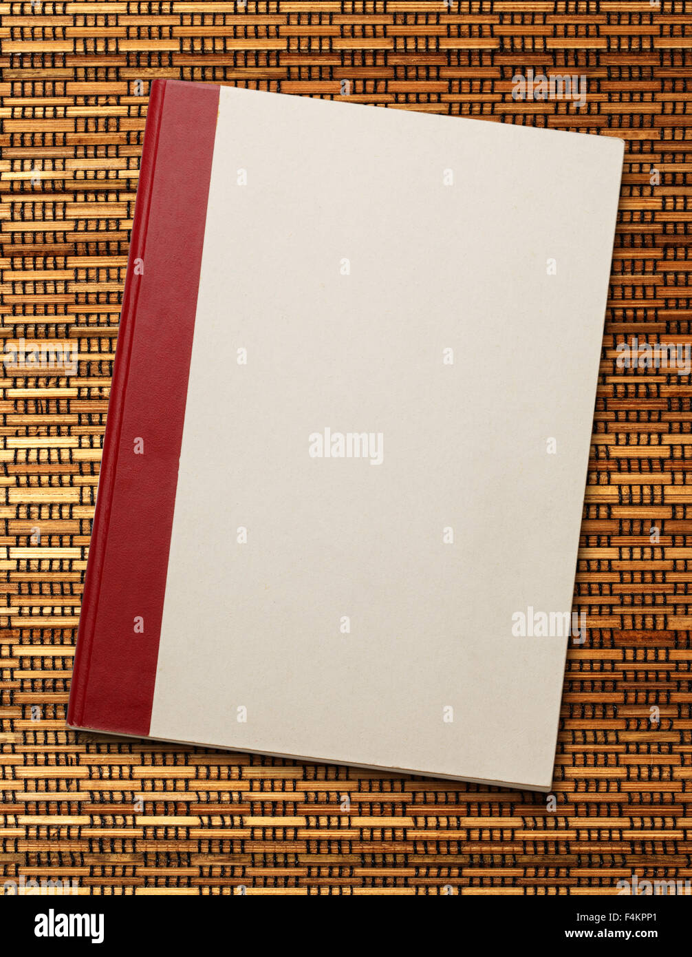 Blank paper notebook on the straw weaving background Stock Photo - Alamy