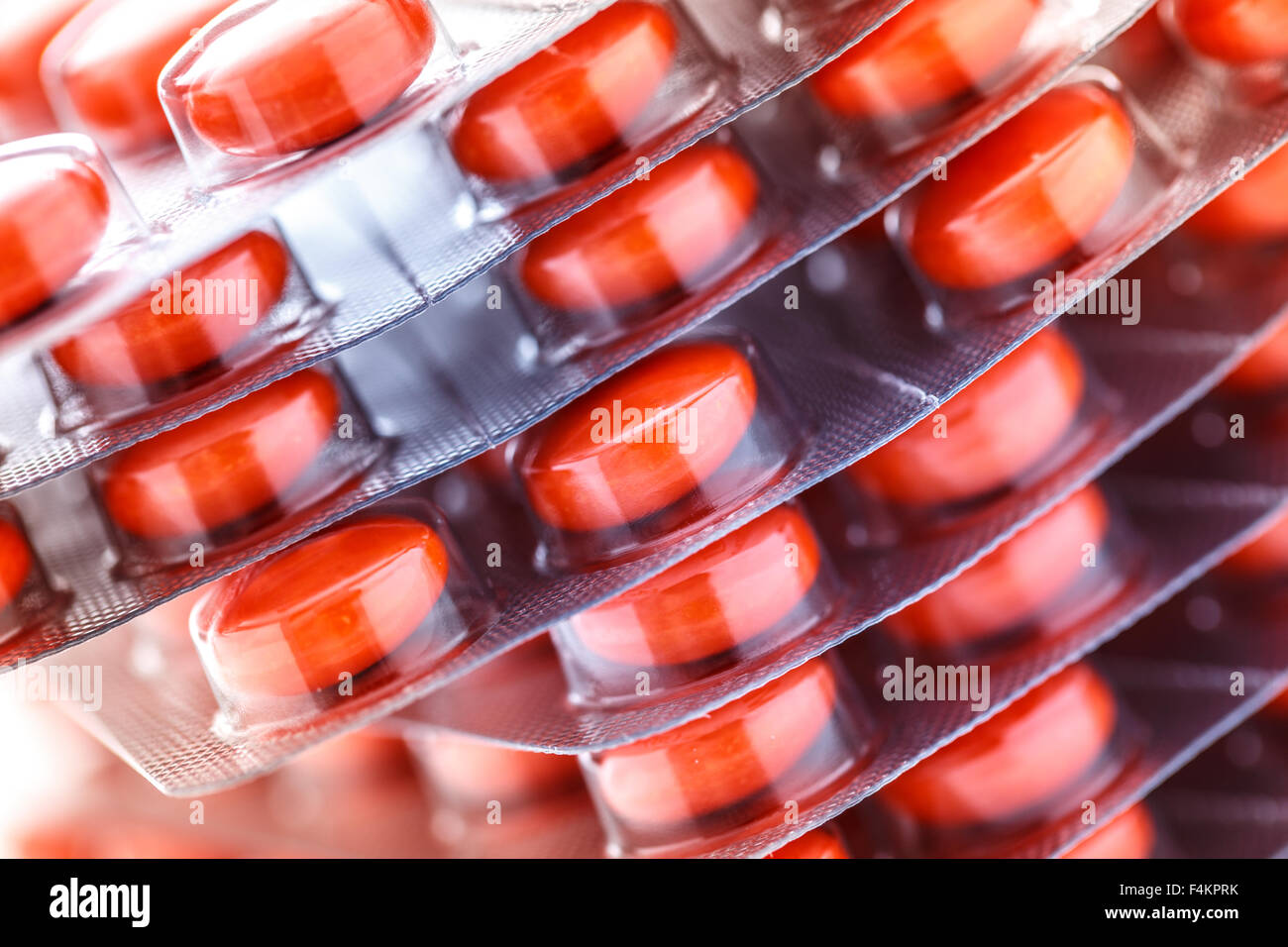 Repackaged Tablets Red tablets in plastic packing as background Stock Photo - Alamy