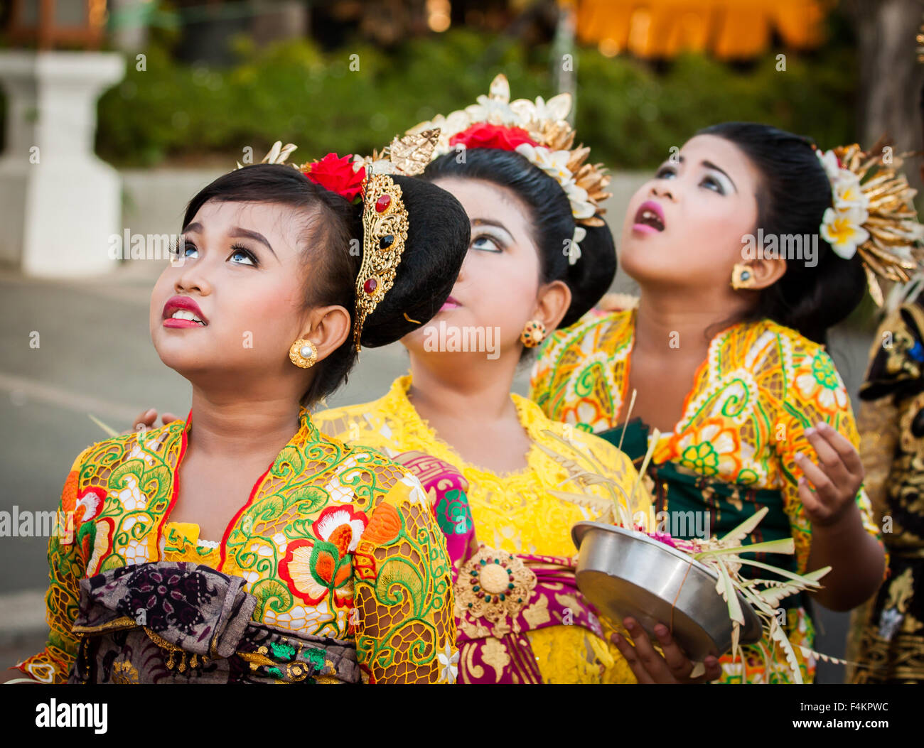 Balinese girls in traditional attire at Sanur Village Festival's street parade on August 30th, 2015 in Bali, Indonesia. Stock Photo