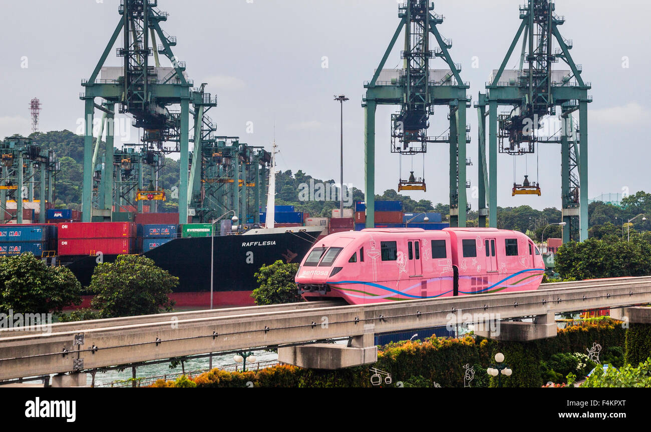 Singapore, monorail link to Sentosa Island against the backdrop of Keppel Container Terminal Stock Photo