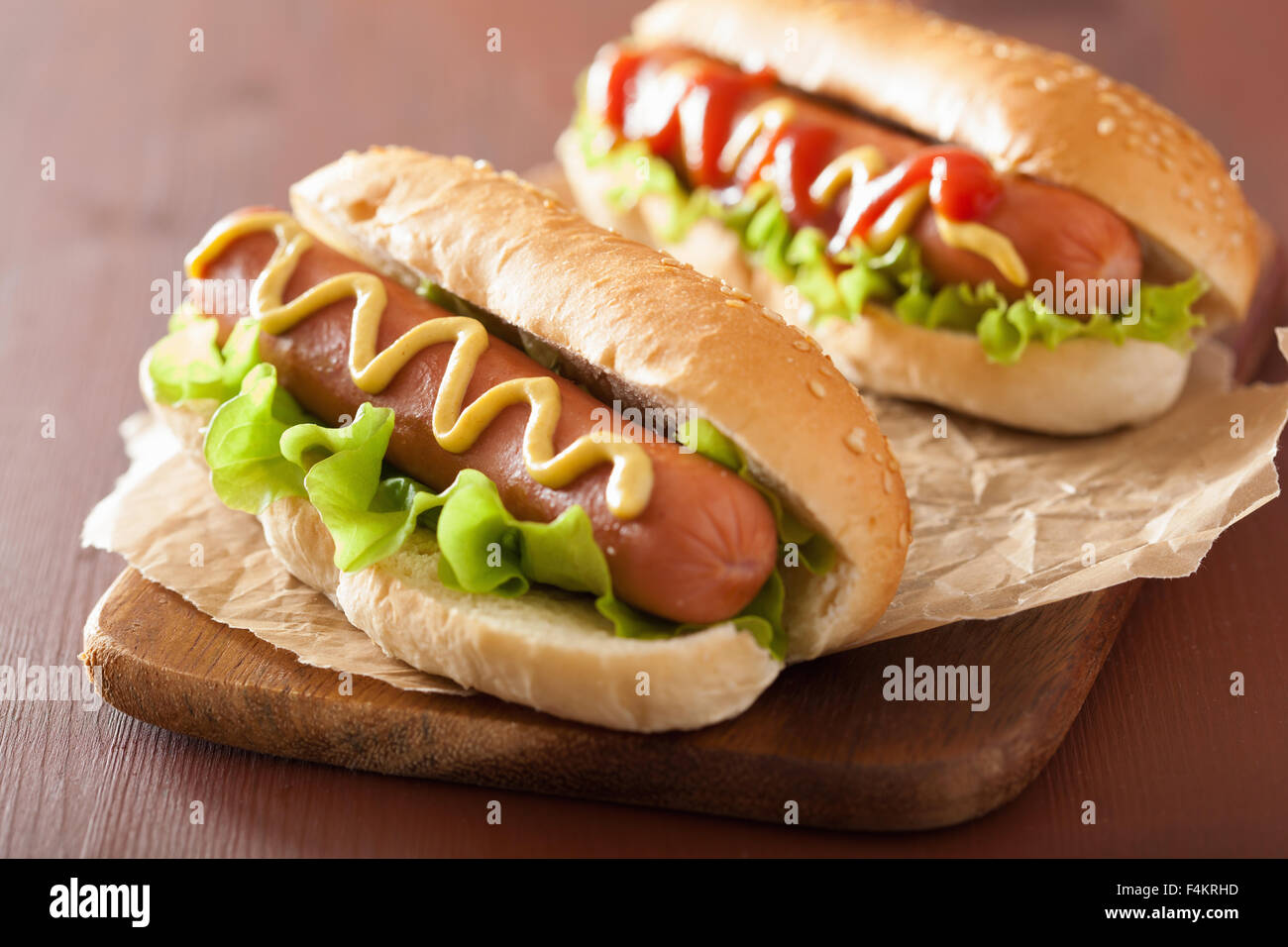 hot dog with ketchup mustard and vegetables Stock Photo